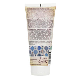 The back of a 200ml squeeze tube of Ghaasoul Cleansing Cream, featuring product details, ingredients, and a blue and white patterned design, on a white background.