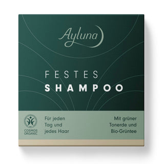 Ayluna Festes Shampoo box packaging, featuring a dark green top half with white text and a light sage green bottom half with German product details and a COSMOS ORGANIC logo.