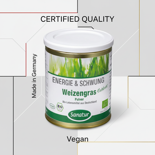 Sanatur Organic Wheatgrass Powder with certification wording on a laboratory-inspired background